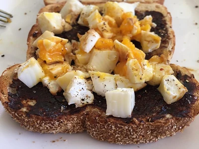 Poached egg and Vegemite on toast.