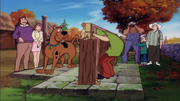 Plaid-shirted male tourist with family (Witch's Ghost)