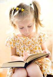 3938636-308461-little-girl-reading-book-1-