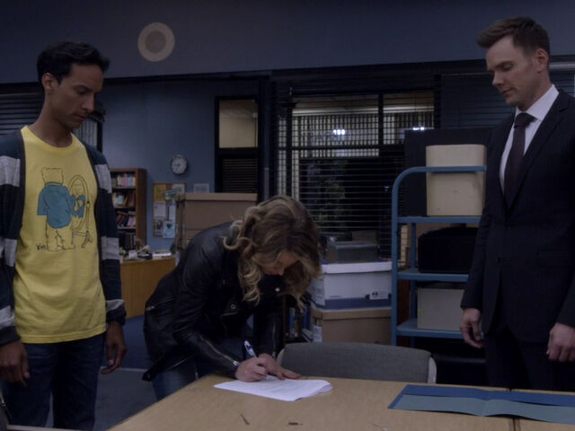 File:5x01-Britta signs Abed Jeff.jpg