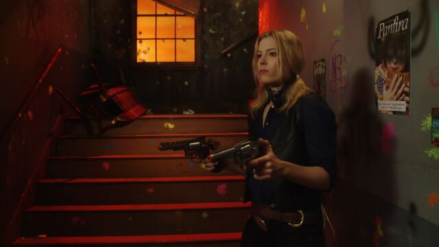 File:2x22 Britta guns wall.jpg