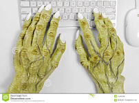 Monster-keyboard-hands-pair-halloween-using-mouse-against-white-background-34444536