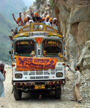Sikh pilgrims cheering on bus to Manikaran