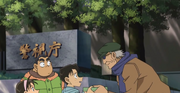 Mitsuhiko cogiendo el paquete para sato.png