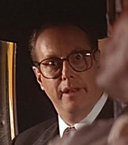 File:Businessman in Taxi.jpg
