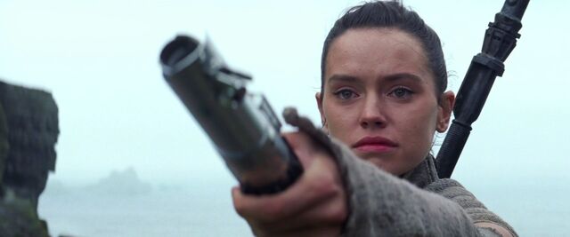 File:Rey Holding Out Lightsaber.jpg