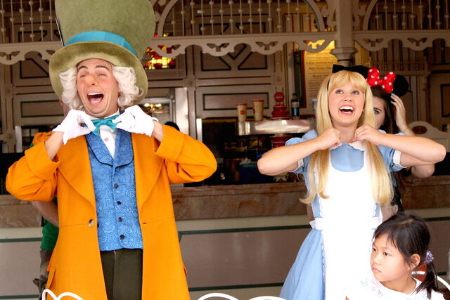 File:Mad Hatter with Alice in the ragtime coke corner @ Disneyland.jpg