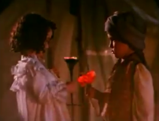 File:KittyTakesTheFlower.png