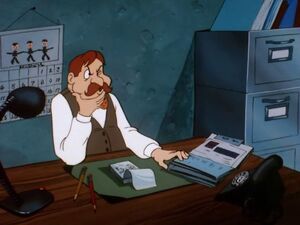Cushette at his desk