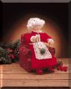Knitting mrs.claus in armchair