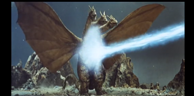 File:Ghidorah is unfazed by Godzilla's atomic breath!.png