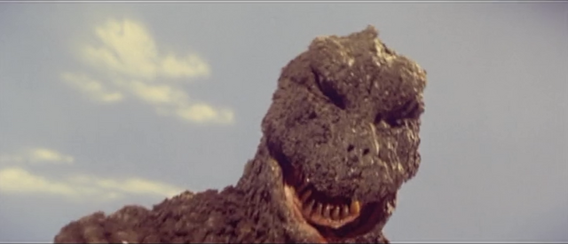 File:All Monsters Attack - Godzilla is in pain.png