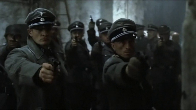 File:Mohnke Gunsche pointing pistols.png