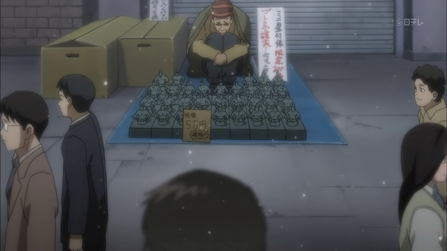 File:Aokisellingthestatues.png