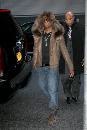 Ne-Yo-wearing-hooded-fur-jacket-and-Louis-Vuitton-Tibet-nubuck-calf-leather-ankle-boots-2