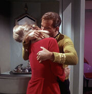 James Kirk forcefully grabs Janice Rand.jpg