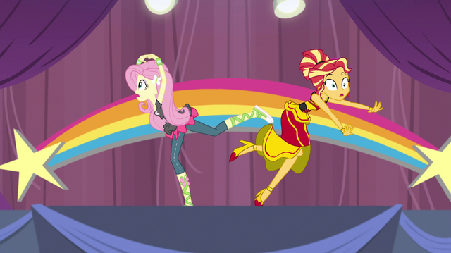File:Fluttershy accidentally knocks Sunset off-balance EGS1.png