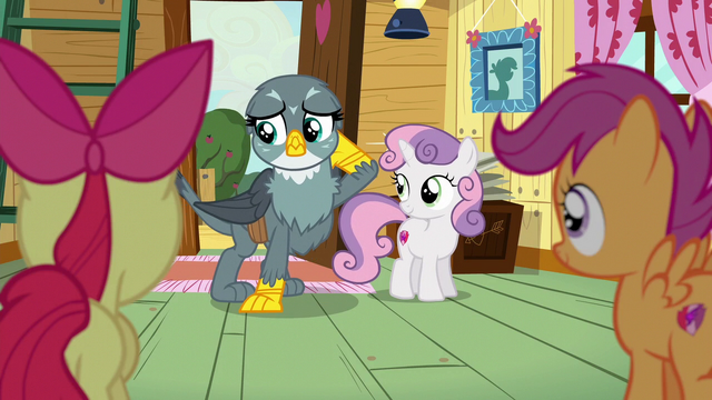 File:Gabby rubbing the back of her head S6E19.png