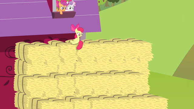 File:Apple Bloom on hay bale looking S4E17.png