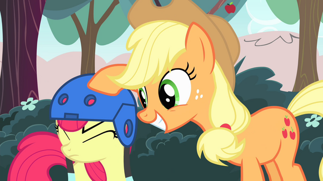 File:Applejack putting a helmet on Apple Bloom S4E17.png
