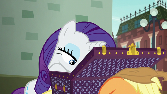 File:Rarity looking through her luggage S5E16.png