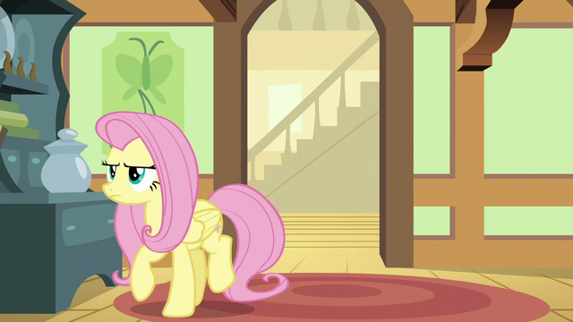 File:Fluttershy turning away from the den door S6E11.png