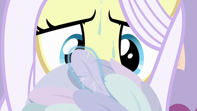 File:Lily Lace carefully sewing feathers into a hat S7E9.png