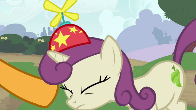 File:Cheese puts hat onto a pony's head S4E12.png