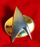 TNG combadge
