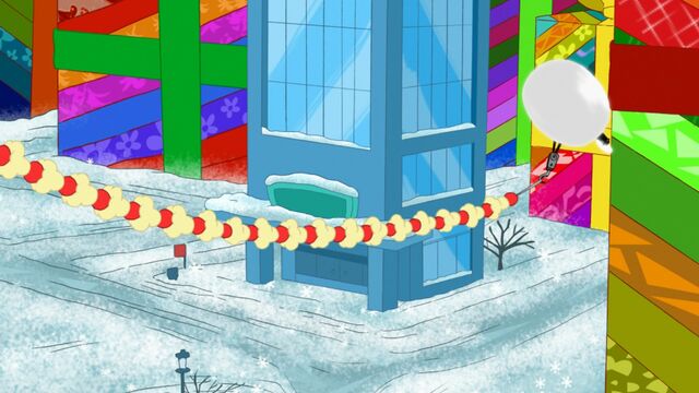 File:Preparing to wrap the building in the popcorn and berry chain.jpg