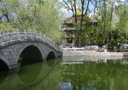 The quiet and peaceful park, pond, and chapel behind the Potala