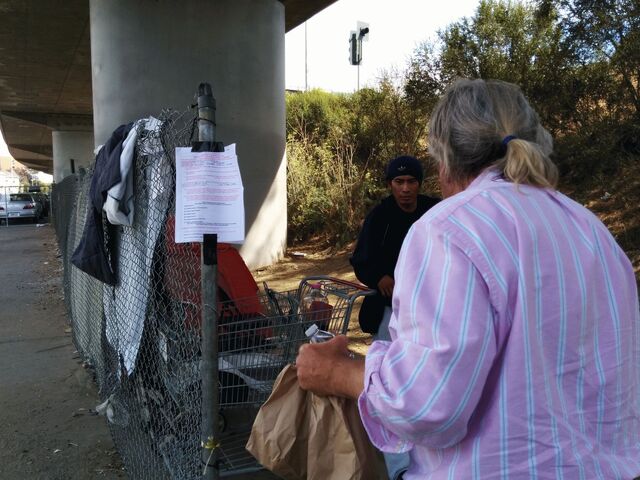 File:Andrew feeding under bridge.jpg
