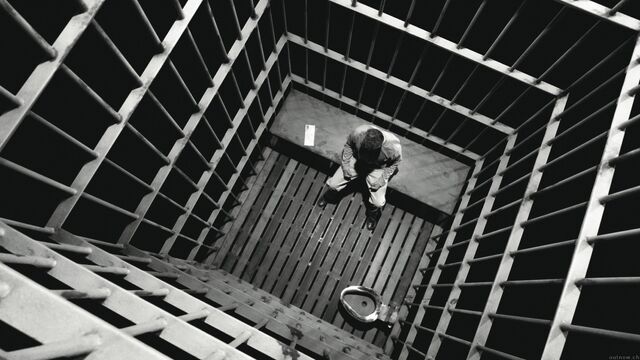File:Alone in his cell.jpg