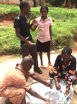 Faustine Odaba with employees of Awamu Biomass Energy Ltd., 9-29-14