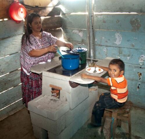 File:Helps International-stove-mother-and-boy.jpg