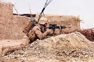 Defense.gov News Photo 120322-M-PH863-005 - U.S. Marine Corps Lance Cpl. Leobardo Nunez provides security during a census patrol through a village near Khan Neshin Afghanistan on March 22