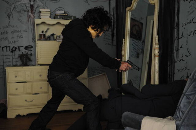 File:1x02 MaskedFollowerWithAGun.jpg