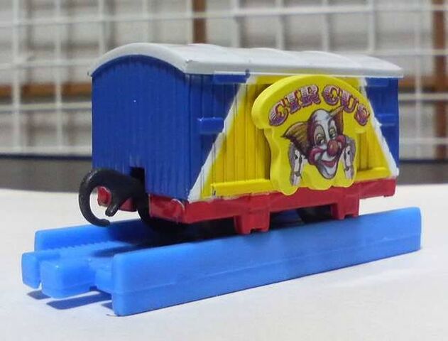 File:CapsulePlarailBlueAndYellowCircusVan.jpg
