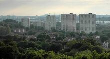 The-blocks-of-flats-on-the-bromford-estate-the-low-rise-houses-among-the-trees-in-the-foreground-are-on-the-firs-estate-in-the-distance-can-be-seen-the-dudley-hills